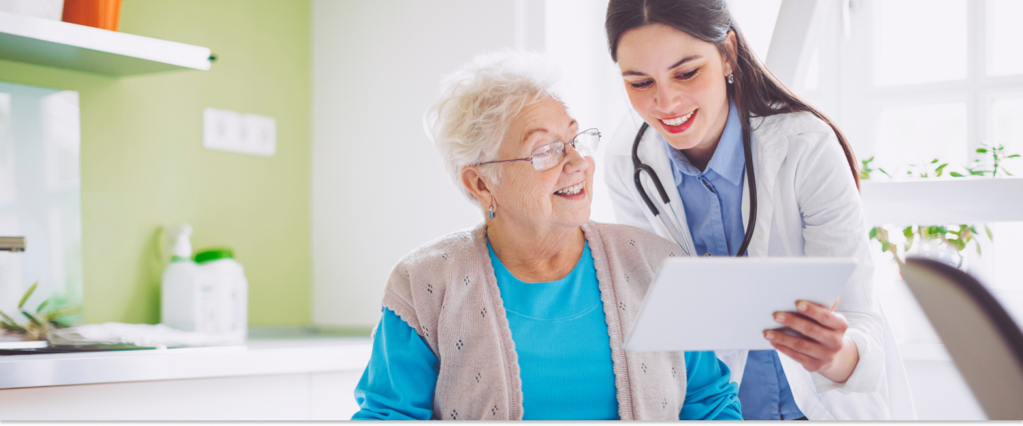 Female doctor talking with female patient.