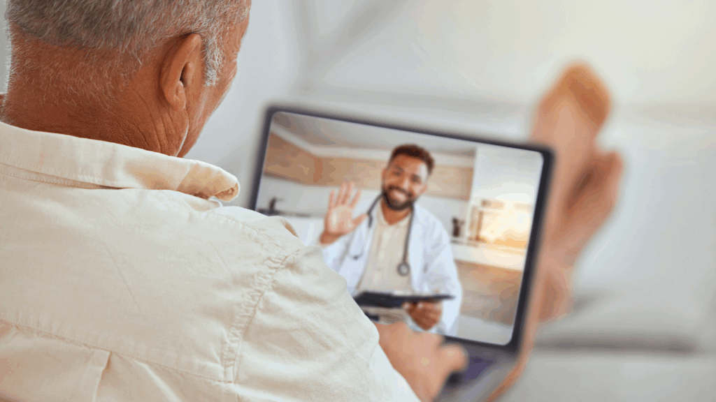 Man uses tablet to meet with Doctor virtually.