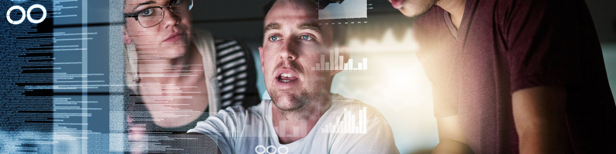 three people looking at various data sources