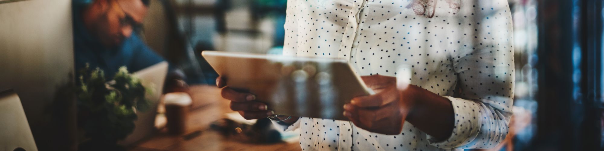 woman holding tablet