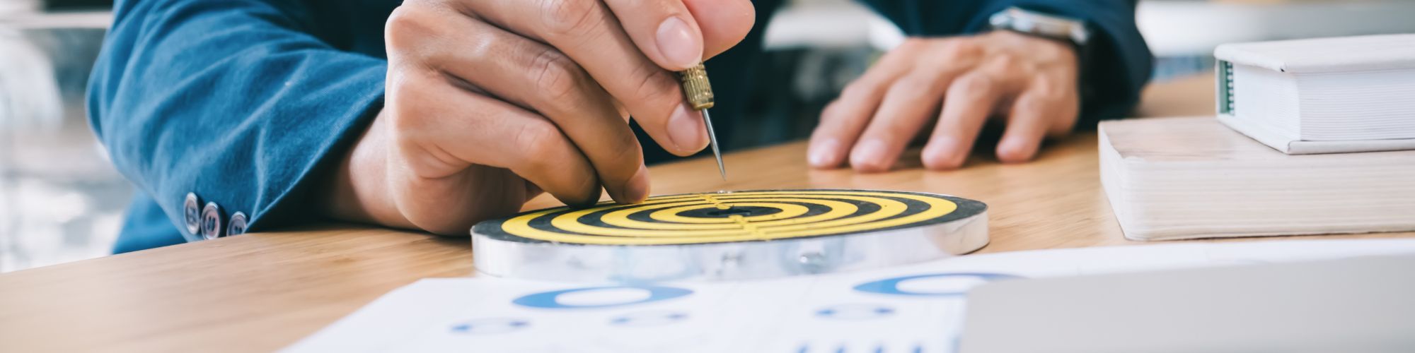 man hitting bullseye on a target