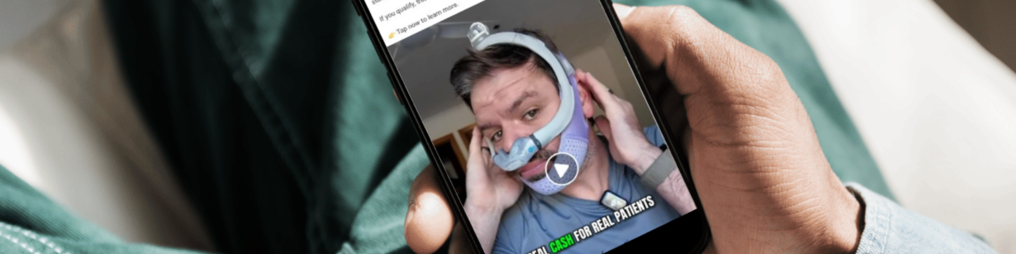 man holding iphone displaying meta scam ad