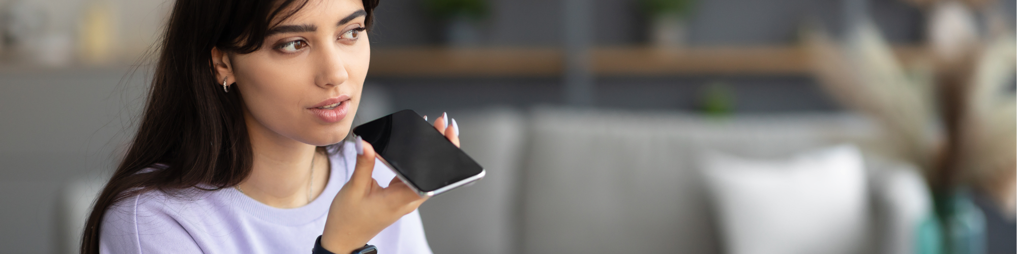 woman using voice search on her iphone