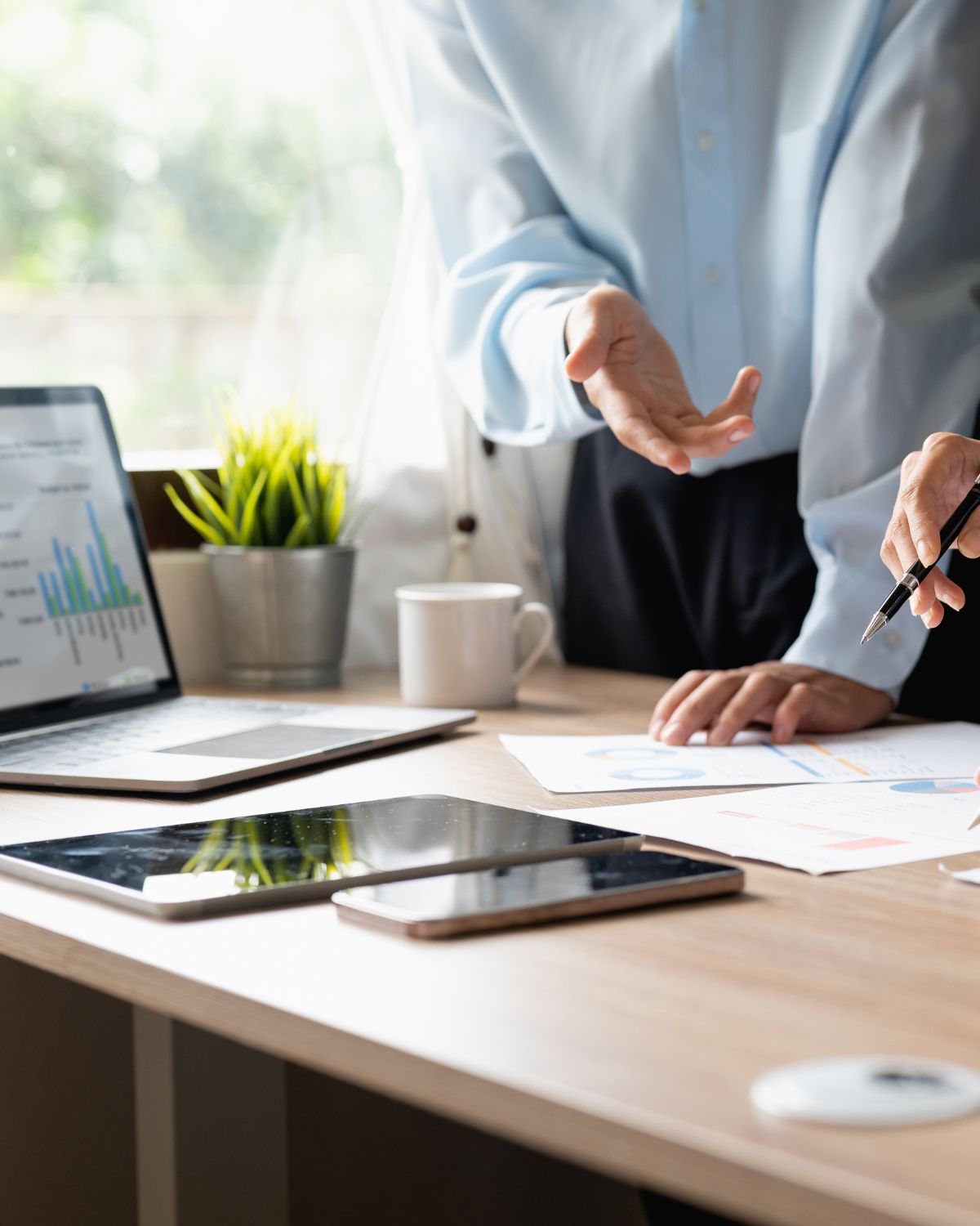 group of people looking at performance data