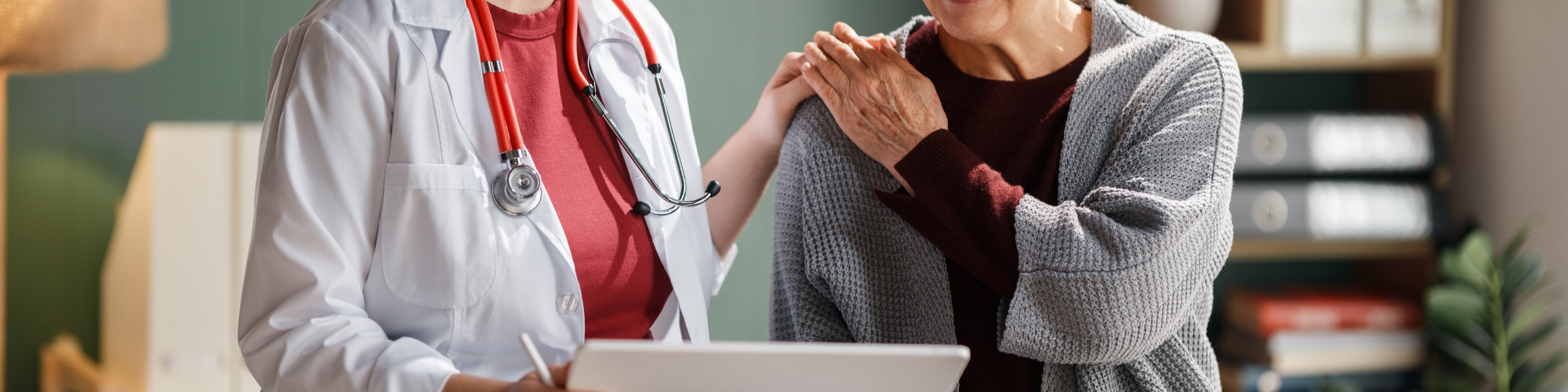 doctor with patient looking at ipad