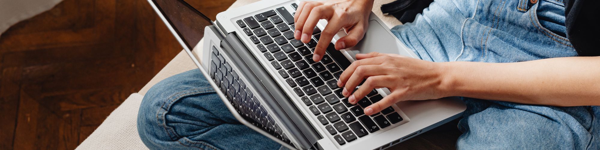 woman typing on laptop