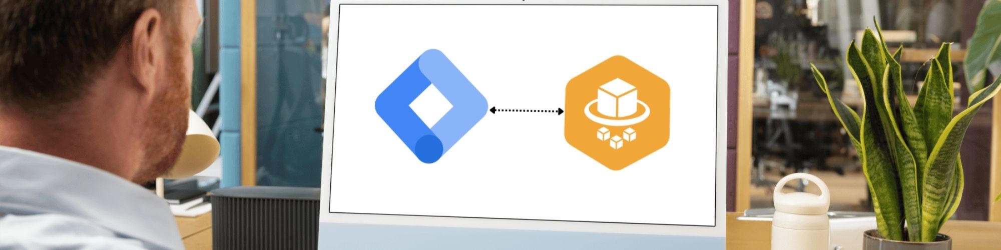 Google Tag Manager and AWS logos on a desktop computer